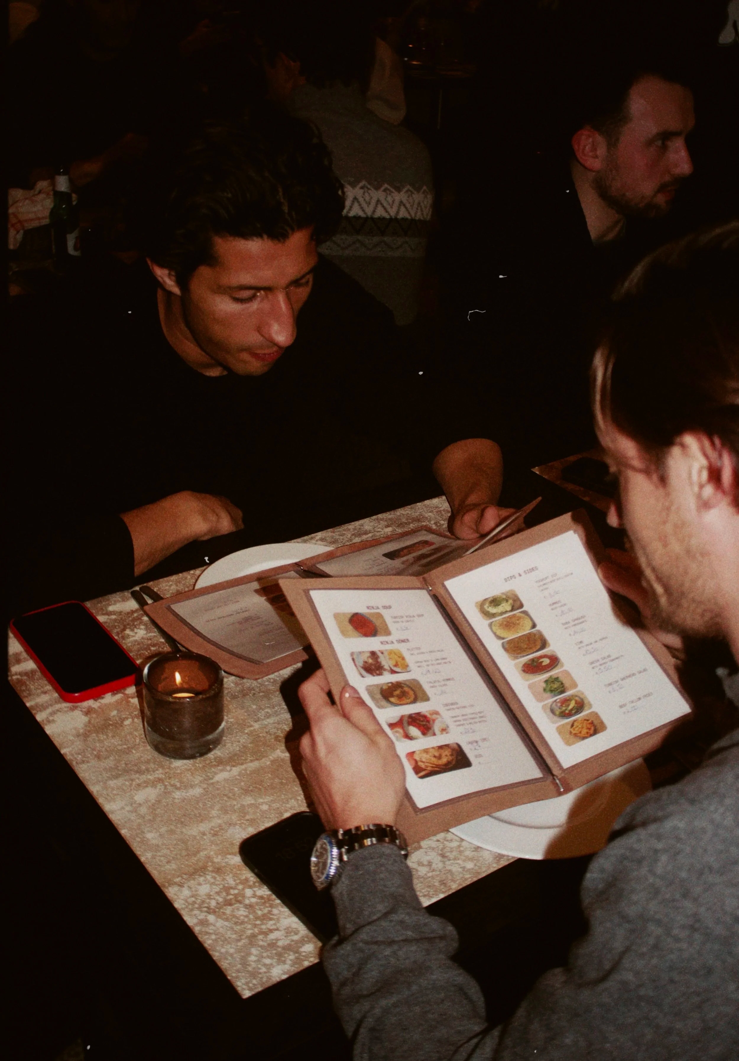 Guests reading the menu at Ninja